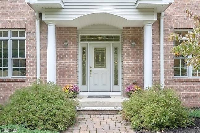 Enjoy mountain views from this light-filled colonial-style home