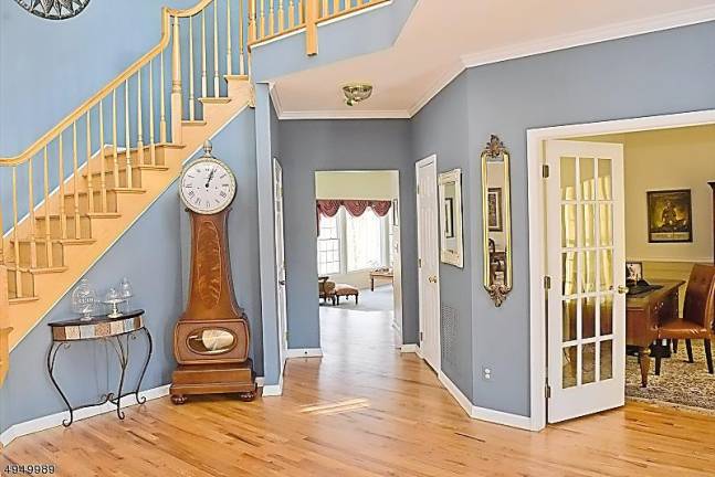 Stately brick-front colonial at Woodcrest Lake offers privacy Stately brick-front colonial at Woodcrest Lake offers privacy