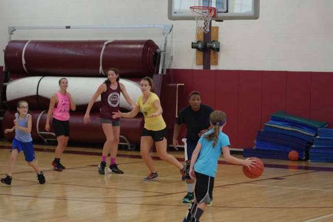 Basketball players learn skills at camp Basketball players learn skills at camp