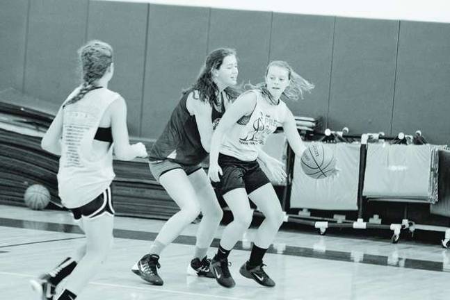 Basketball players learn skills at camp From left Maddie Leonardi (13), Addi Hillard (17) and April Serratelli (14) on the court. All three are from Newton.