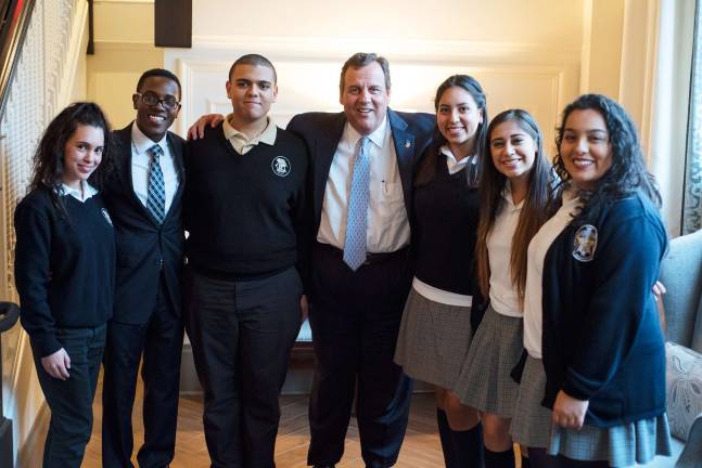 Annual Lawyers Dinner for Tri-County Scholarship Fund The governor with the students. From left, Genesis Perez, DeAndre Tomlinson, Kevin Arias, Gov. Chris Christie, Chrystal Donayre, Ashley Contreras, and Jennifer Mora-Amaya. All students are from Paterson.