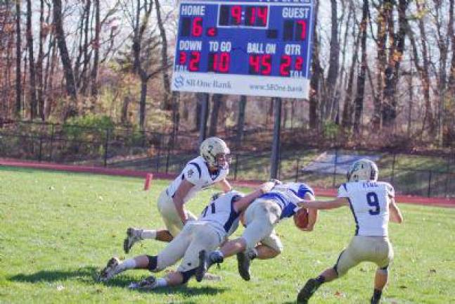 After a long gain Kittatinny ball carrier Jacob Mafaro is caught by Morris Catholic defenders in the second quarter. Mafaro rushed for 135 yards and scored 1 touchdown.