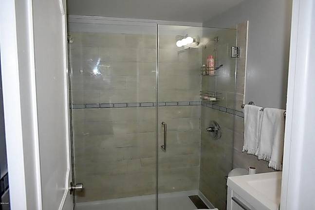 Two-bedroom ranch offers easy lakefront living Shower