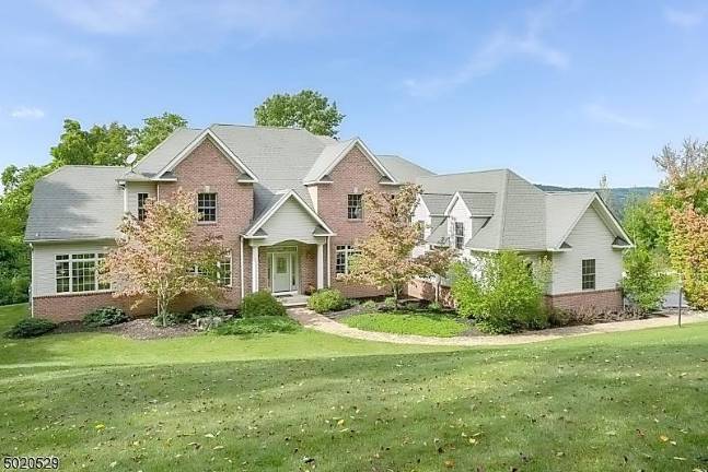 Enjoy mountain views from this light-filled colonial-style home