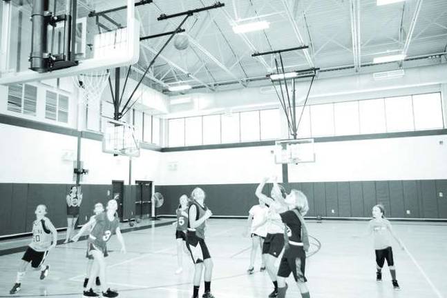 Basketball players learn skills at camp Basketball players learn skills at camp