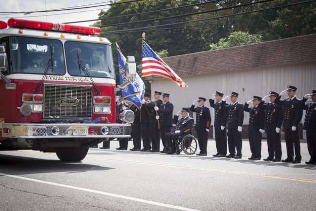 Byram's first Line Of Duty Death Ceremony Firefighters from the Byram Fire Dept line Route 206 in front of the fire house as the procession of fire trucks pass by during the LODD Ceremony for FF Richard Choate.