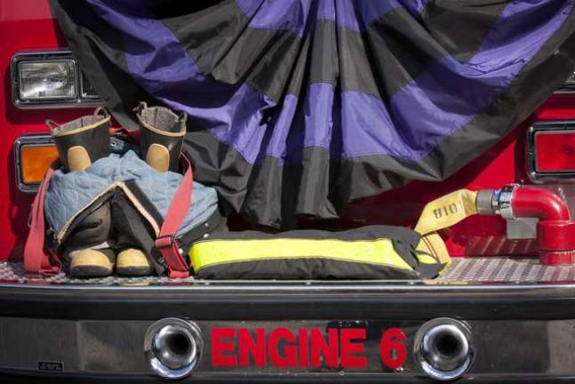 FF Richard Choate's gear, including helmet, boots, and jacket were placed on the front fender of Engine 6, the engine that Choate had driven to the call on Sept. 8 during his LODD Ceremony in Byram Twp on Sept. 20.
