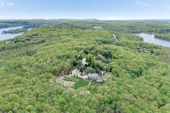 Home on five manicured acres has pool, movie theater