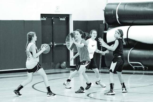 Basketball players learn skills at camp Basketball players learn skills at camp