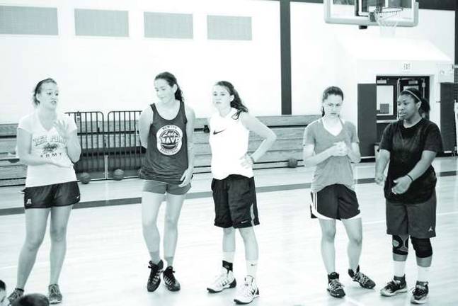 Basketball players learn skills at camp Newton High School varsity girls basketball head coach Whitney Dugan and high school players and camp counselors Addi Hillard (17), Jurly Schomp (16), Anna Keimel (17) and Kayla Chambliss (17).