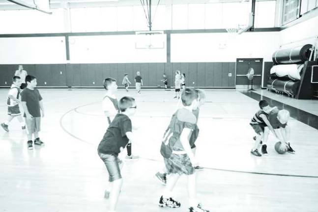 Basketball players learn skills at camp Basketball players learn skills at camp