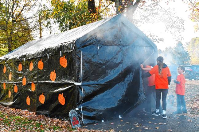 Photos: Haunted Hawk Hustle 5K Participants in the Haunted Hawk Hustle 5K and one-mile Fun Run enter a haunted house area Saturday, Oct. 11.