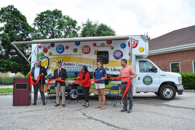 New mobile library launched <b>DOT3 </b>From left are Will Porter, director of the Sussex County Library System; Sussex County Commissioner Jack DeGroot, state Assemblywoman Dawn Fantasia; Jill Space, deputy director of the commissioners board; and Chris Carney, director of the board, at a ceremony to launch Dot, the new mobile library, on Wednesday, June 18 outside the Sussex-Wantage branch.