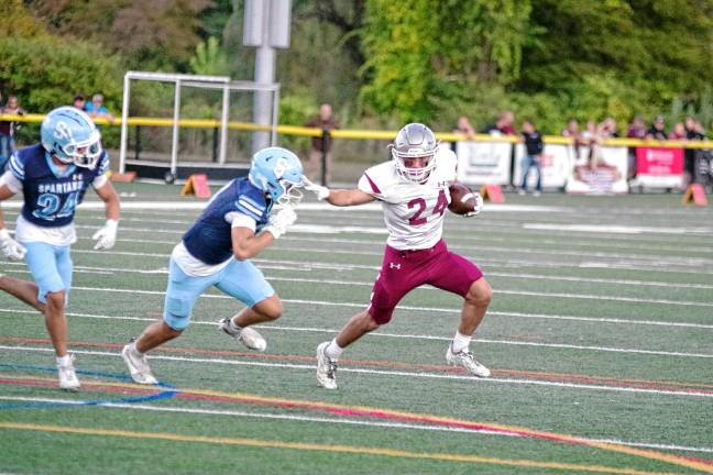 Football roundup: High Point remains undefeated <b>Newton ball carrier Evan Cotter puts a stiff-arm on a Sparta defender. He made one touchdown, rushed for 91 yards and caught three passes for 137 yards.</b>