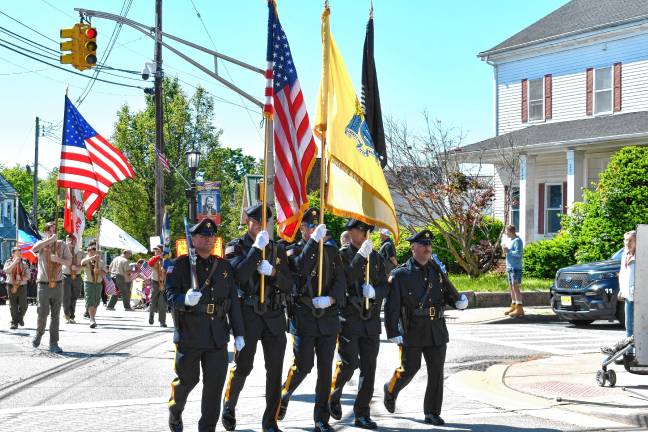 Photos: Memorial Day Parade in Newton A police honor guard leads the parade.
