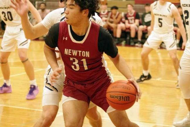 NW1 Newton's Kai Moody handles the ball in the third period of a game against Roxbury on Friday, Dec. 29. Roxbury won, 54-35. (Photos by George Leroy Hunter)