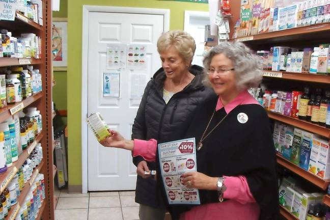 Dr. Dani Segal with a customer at Healthy Thymes Market in 2019, when the shop celebrated 30 years in Vernon (File photo by Janet Redyke)