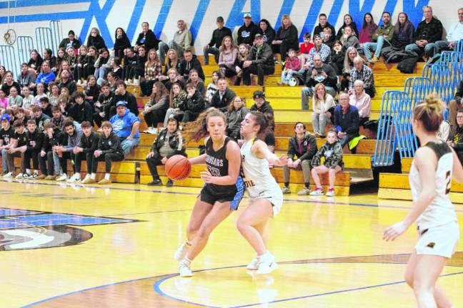 KT1 Kittatinny's Olivia Lombardo handles the ball while covered by Cedar Grove's Isabella Coletta. Kittatinny lost, 47-43, in the first round of the NJSIAA North 1 Group 1 Sectional Tournament on Thursday, Feb. 22. (Photo by George Leroy Hunter)