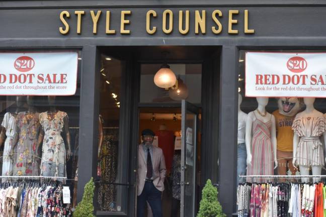 Bob Maxwell, co-owner of Style Counsel in Warwick, N.Y., which has been doing brisk business since retail stores were allowed to reopen with safety measures. (He took his mask off momentarily for the photo.) (Photo by Becca Tucker)