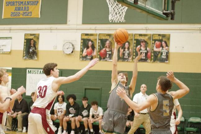 Sussex Tech's Eliot Griner lifts the ball toward the hoop. He scored 16 points.