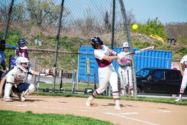 Newton batter Melissa Fehr connects with the ball in the first inning.