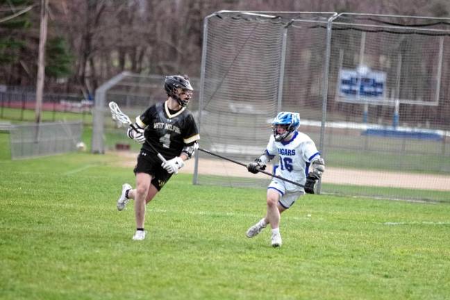 West Milford's Jake Kelshaw carries the ball as Kittatinny's Greyson Lobb keeps pace. Kelshaw scored one goal.