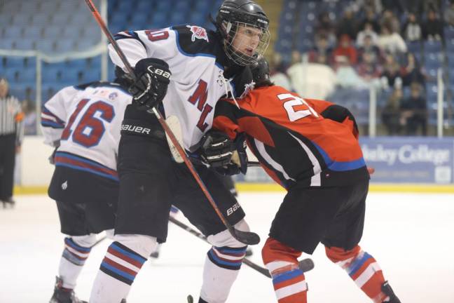 Senior Justin Zappe of N/LV wrestles with a High Point player after a faceoff.