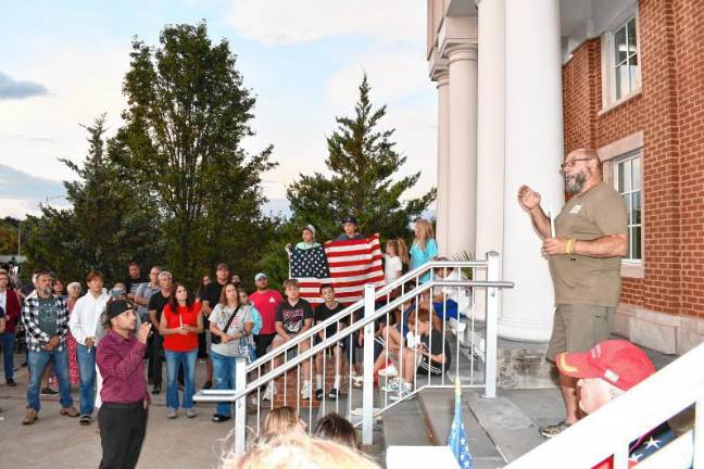 UPDATED: Action on flags attracts criticism Peter Litchfield, commander of Sparta Veterans of Foreign Wars Post #7248, speaks at the vigil. (Photo by Maria Kovic)