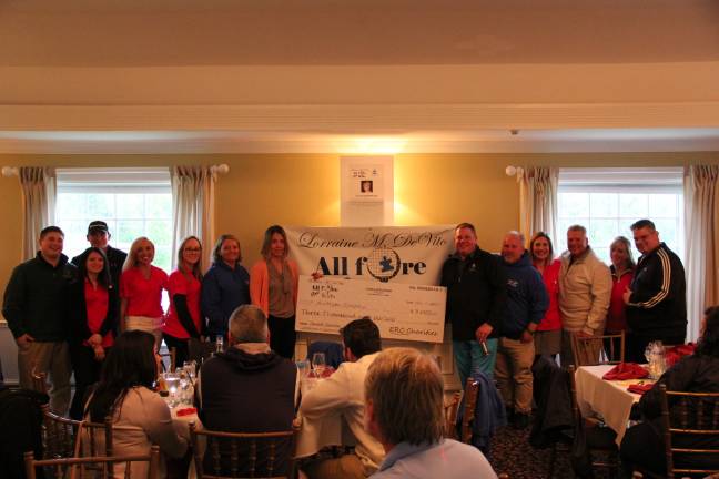 'All fore kids' Charity Golf Outing Salvatore Dispenziere III Presents check to Austim Speaks with ERC Charities from (left to right) Matthew DeVito, Nuri Gunes, Michelle Belveduto, Joanne Dispenziere, Holly Pressl, Donna DeVane, Karen from Autism Speaks, Salvatore Dispenziere III, Pete Dispenziere, Julia Dick, Salvatore Dispenziere Jr., Susan Dispenziere, and David Buys II. (Photos provided)