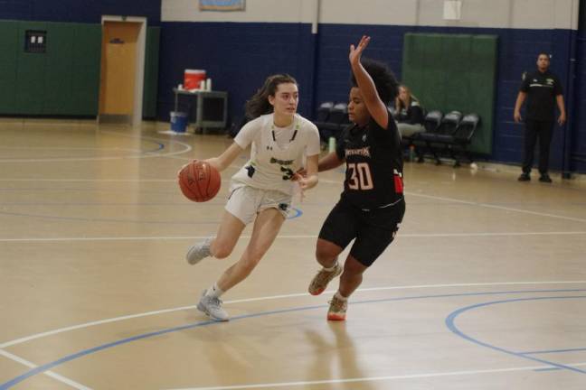 Sophia Brondo of SCCC dribbles the ball while covered by Northampton's Jadalyn Urena. She scored three points in the game.