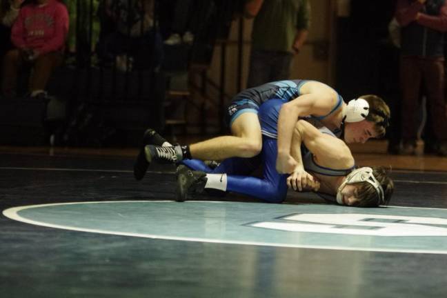 Sparta's Patrick Bruseo, top, puts pressure on Kittatinny's Nikolas Martinez in the 120-pound weight class. Bruseo won by decision, 3-0, on Jan. 26.