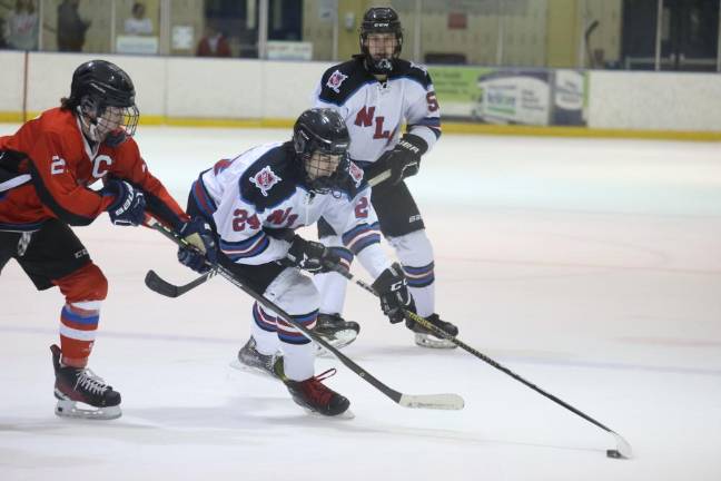 Junior Tanner Gaboda (24) of N/LV handles the puck.