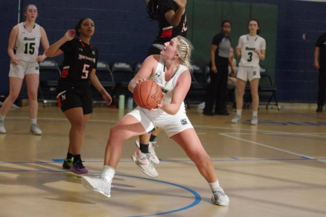 Riley Feichtl of Sussex County Community College handles the ball in the second half of the game against Northampton on Saturday, Jan. 13. She scored 19 points. Northampton won, 87-49. (Photos by George Leroy Hunter)