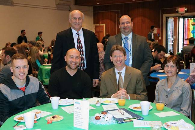 Pictured from left to right, seated: Zachary Novak, men&#x2019;s soccer player; Frank Vernacchio, head men&#x2019;s and women&#x2019;s soccer coach; SCCC President Jon Connolly, and his wife, Joan Connolly. Back row: John Kuntz, associate dean of athletics; and Todd Poltersdorf, director of admissions.