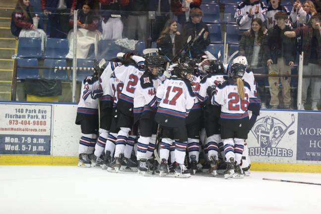 N/LV celebrates after the buzzer.