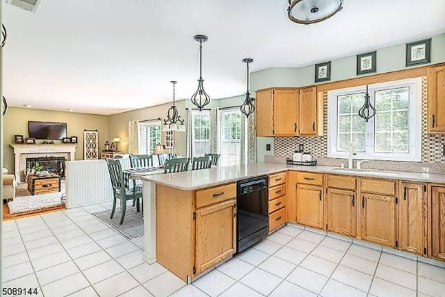 Home with classic beauty is nestled in a mature landscape Home with classic beauty is nestled in a mature landscape