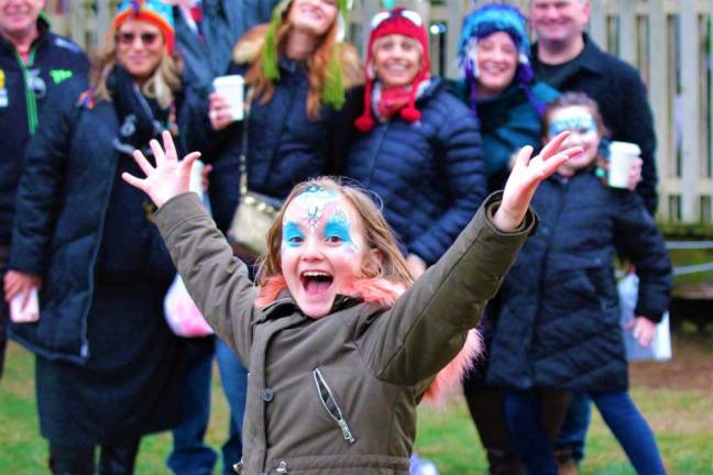 Young girl does the perfect photo bomb at the Lake Mohawk German Christmas Market.