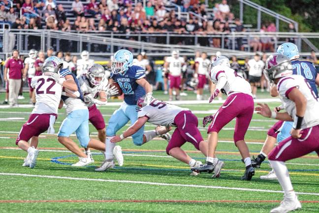 Football roundup: High Point remains undefeated <b>Sparta ball carrier Brady Shagawat on the run in the first half of the game against Newton on Friday, Sept. 19. He made three touchdowns and rushed for 96 yards. The Spartans won, 35-20. (Photos by George Leroy Hunter)</b>