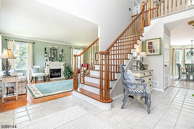 Home with classic beauty is nestled in a mature landscape Home with classic beauty is nestled in a mature landscape