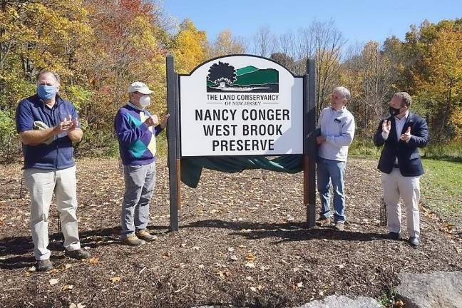 A fitting testament to Nancy’s legacy Pictured from left to right are: Andy Dietz, Land Conservancy Chair of the Board; Bill Conger; Land Conservancy President David Epstein; and U.S. Rep. David Epstein. Provided photo.