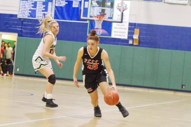 Passaic County's Sabrina DeFreese moves the ball past Sussex County's Alyssa Aragona in the second half.