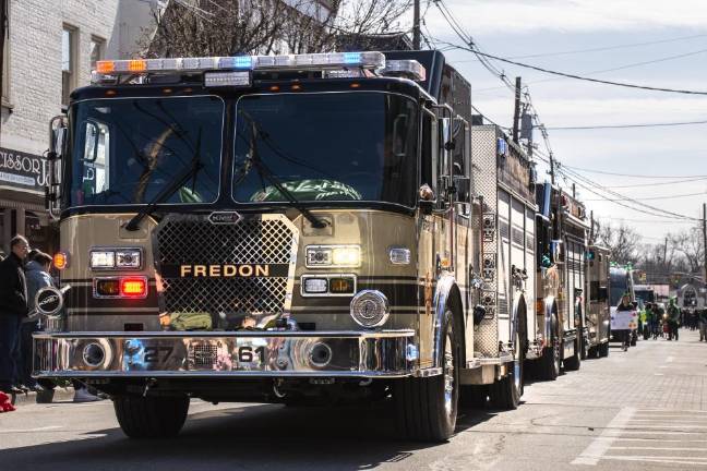 The Fredon Fire Department makes its way down the street.