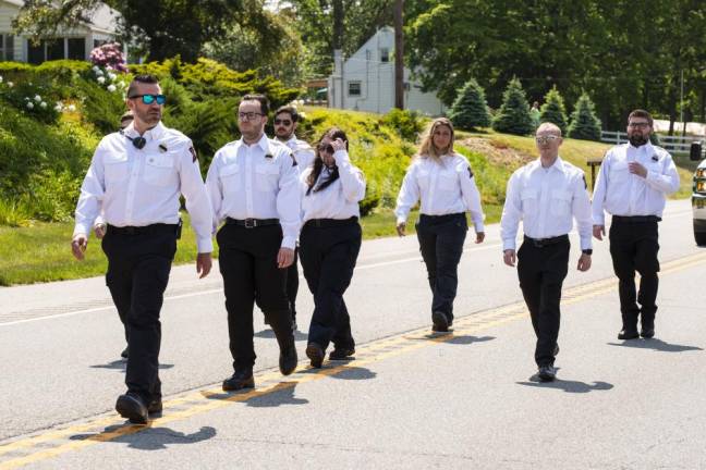 Members of the Lakeland First Aid Squad march in the parade.