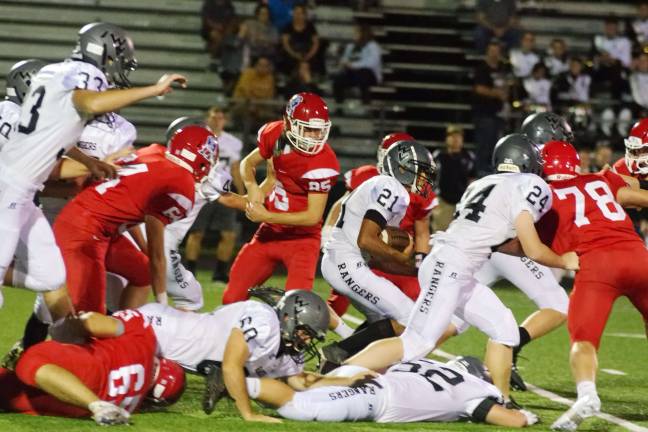 LVRHS beats Wallkill, 19-7 Wallkill Valley ball carrier Justin Rivera (21) moves through a cluster of bodies during a kick return in the first half.