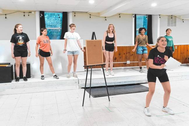 ‘Legally Blonde’ at SCCC through today <b>Jenna Flake, front, playing Elle, rehearses with Delta Nu sisters played by, from left, Katie Colgan, Marley Lane, Maya McQueen, Ella Simmons, Arianna Costillo and McKenna Vasquez. (Photos by Jodi Halteman)</b>