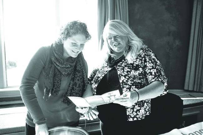 Sussex County chamber hosts business expo Lauren Heath of Dingmans Ferry, Pa., and Donna Mertrud-Skettini of Vernon review a booklet entitled Welcome Home that describes what is involved with becoming an international student exchange host family. The two were at the exposition to encourage area families to host exchange students.