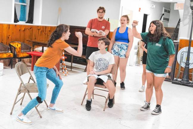 ‘Legally Blonde’ at SCCC through today <b>Clockwise from left, Olivia Tomlin, Luke Simmons, Julia Kadar, Emily Gogick and Jay Granholm, center, rehearse the courtroom scene.</b>