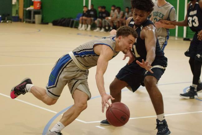 Camden downs Sussex in men's hoops Sussex County's Frankie Rios dribbles the ball past Camden's Abdulazim Bey-Price. Rios scored 19 points. Photos by George Leroy Hunter