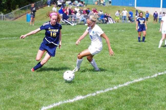Cougars maul Vikings in girls soccer Vernon's Catherine McCabe is shadowed by Kittatinny's Elizabeth Hirsch.