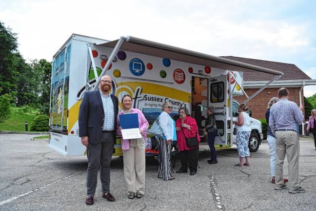 New mobile library launched <b>At left are Will Porter, director of the Sussex County Library System, with Madison Woollen, representing Rep. Josh Gottheimer, D-5.</b>